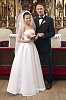 Bride and groom standing after changing rings