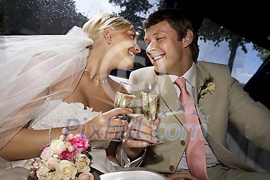 Happy couple enjoing a glass of champagne