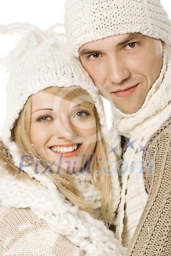 Couple in winter clothes being happy 