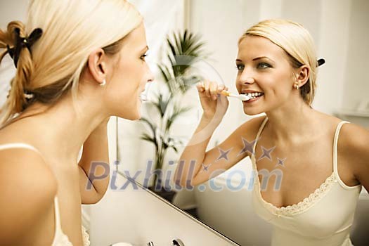 Woman brushing her teeth