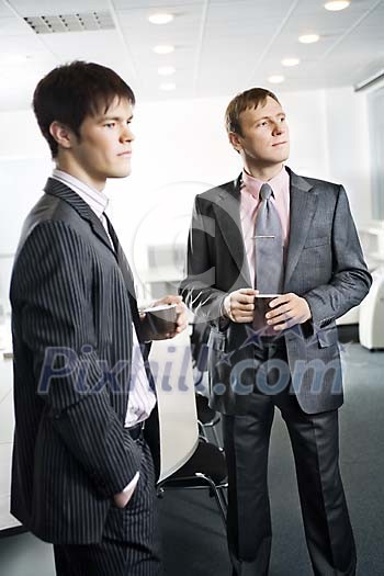 Two businessmen having a coffee