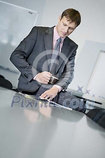 Businessman reading a raport Businessman reading a raport