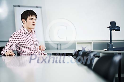Businessman sitting in the meeting room Businessman sitting in the meeting room