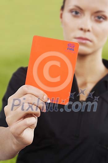 Woman referee showing the red card