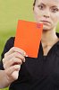 Woman referee showing the red card
