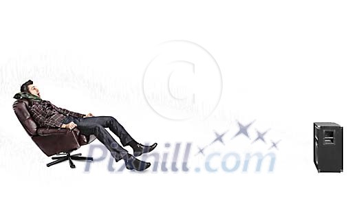 Man sitting in the chair while listening to loud music Man sitting in the chair while listening to loud music