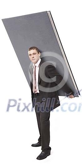 Businessman carrying a big book Businessman carrying a big book