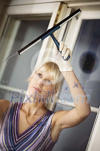 Woman cleaning the windows Woman cleaning the windows