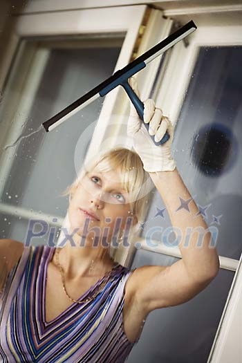 Woman cleaning the windows