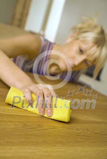 Woman cleaning the table