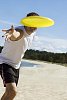 Man throwing a frisbee at the camera