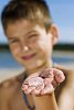 Boy showing a jellyfish on his hand