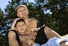 Man with his son chilling on the beach