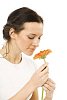 Woman smelling the gerbera
