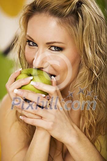 Woman taking a bite of apple