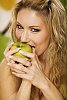 Woman taking a bite of apple