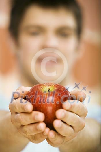 Man offering an apple Man offering an apple