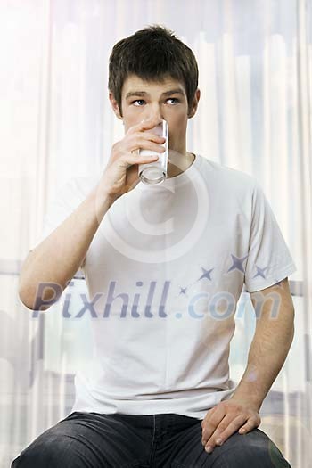 Man drinking a glass of milk Man drinking a glass of milk