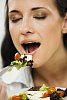 Woman eating salad