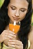 Woman smelling a glass of juice