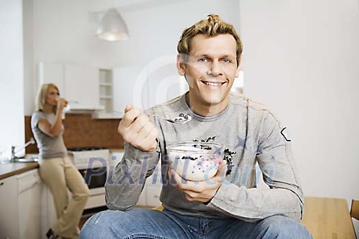 Man having a bowl of dessert