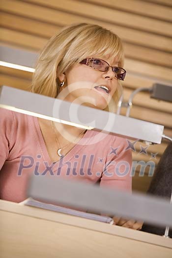 Woman sitting in the classroom Woman sitting in the classroom