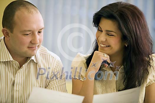 Woman and man reading documents