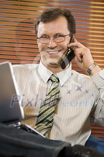 Portrait of a businessman calling