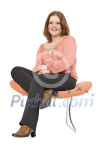 Woman sitting on a white background