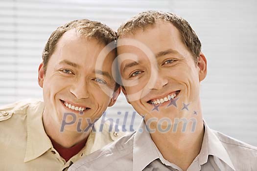 Male twins smiling Male twins smiling