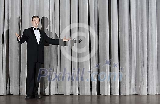 Man standing alone on a stage