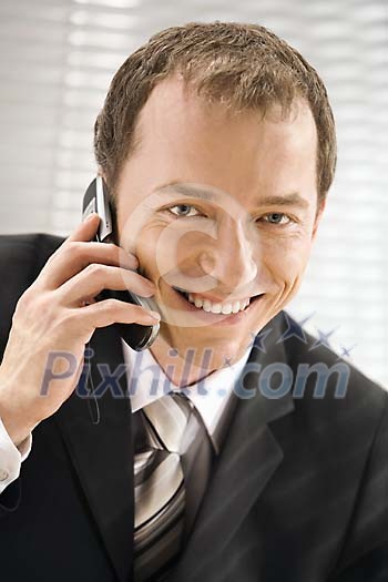 Businessman smiling while calling Businessman smiling while calling