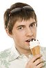 Man in summer clothes eating icecream