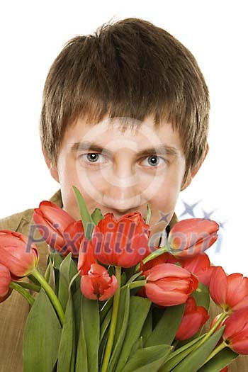 Man in spring clothes and with tulips