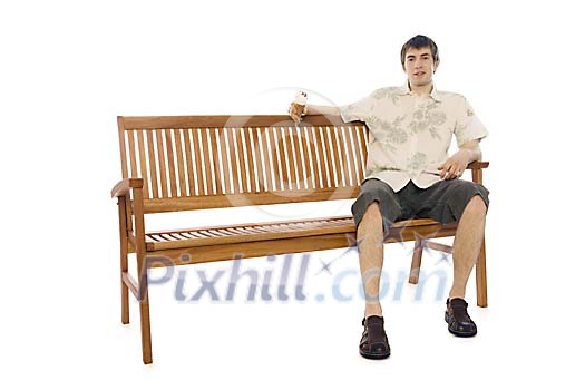 Man sitting on the bench in summer clothes