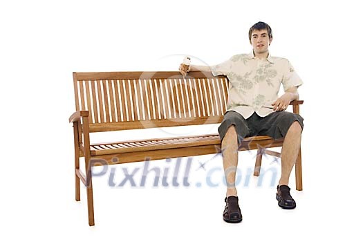 Man sitting on the bench in summer clothes Man sitting on the bench in summer clothes