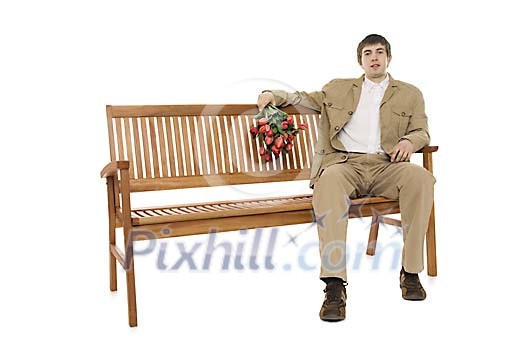 Man sitting on the bench in spring clothes