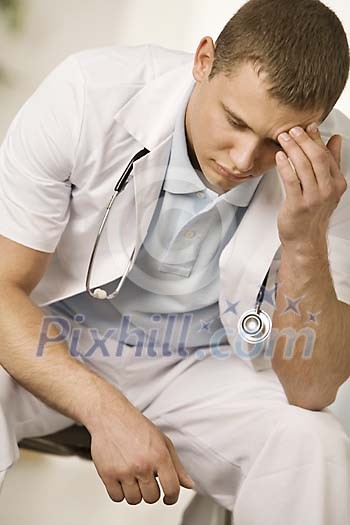 Portrait of a stressed male doctor