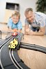 Father and son playing with cars