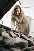 Woman checking under the hood