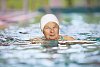 Older woman swimming in the pool