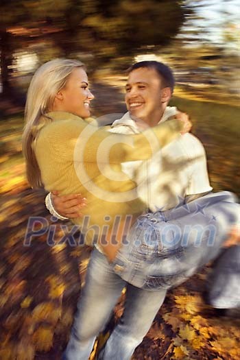 Man holding a woman and spinning Man holding a woman and spinning