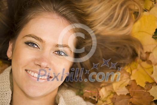 Closeup of a womans face on the leaves
