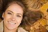 Closeup of a womans face on the leaves