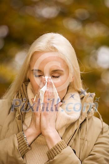 Woman sneezing Woman sneezing