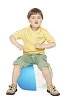 Boy sitting on the beachball