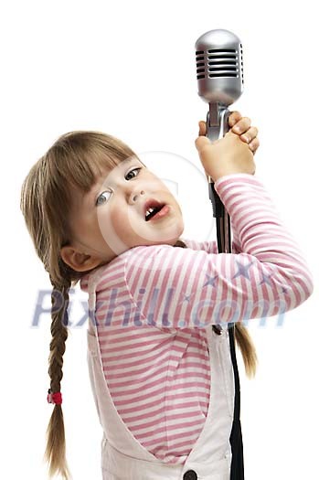Young girl trying to reach the microphone