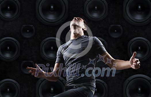 Man dancing in front of the speakers