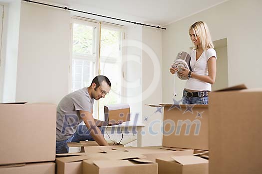 Man and woman unpacking