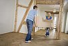 Man and woman carrying a couch